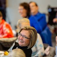 woman smiling during discussion